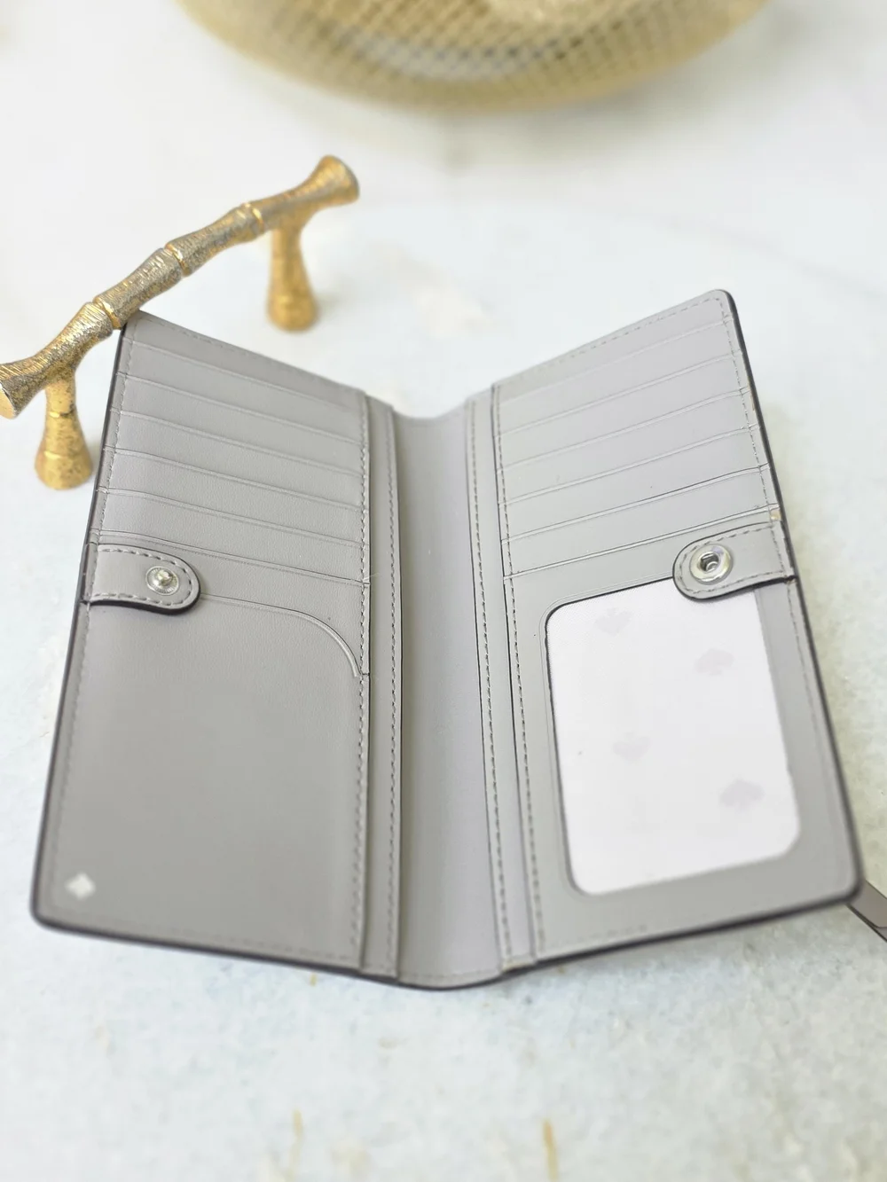 Kate Spade New York Gray Saffiano Large Slim Bifold Wallet Silver Logo